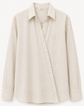 Beige shirt with a brand logo on a white background
